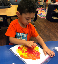 A Boy Finger Painting